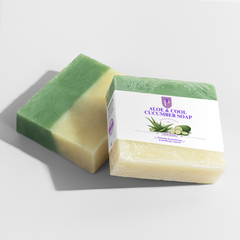 Two bars of Aloe & Cool Cucumber Soap on a light gray background, one unwrapped showing a green and pale yellow marbled texture, and one wrapped in clear plastic with a white label.
