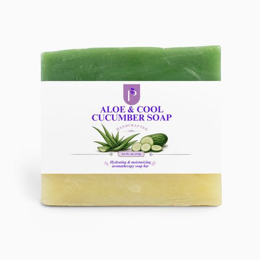 A handcrafted Aloe & Cool Cucumber soap bar with a white paper label, featuring a green top half and a pale yellow bottom half, on a clean white background.