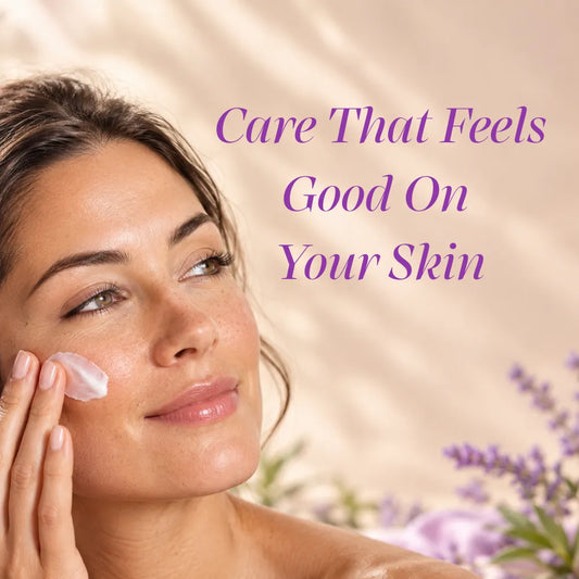 A woman with smooth skin applies a white facial cream to her cheek, with purple text reading 'Care That Feels Good On Your Skin' over a soft beige background with lavender flowers.