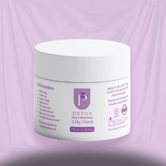 A white plastic jar of Persepolo Detox Clay Mask with purple text and logo, set against a draped lavender background.