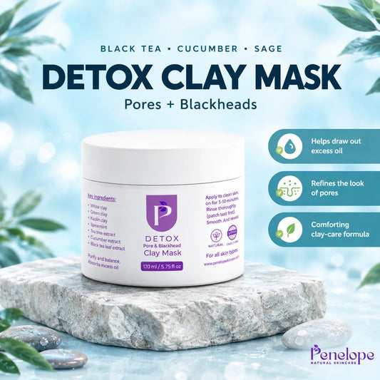 Penelope Natural Beauty Detox Clay Mask in a white jar, displayed on a gray stone slab with water and leaves in the background. The image includes text highlighting ingredients (black tea, cucumber, sage) and benefits of the mask.