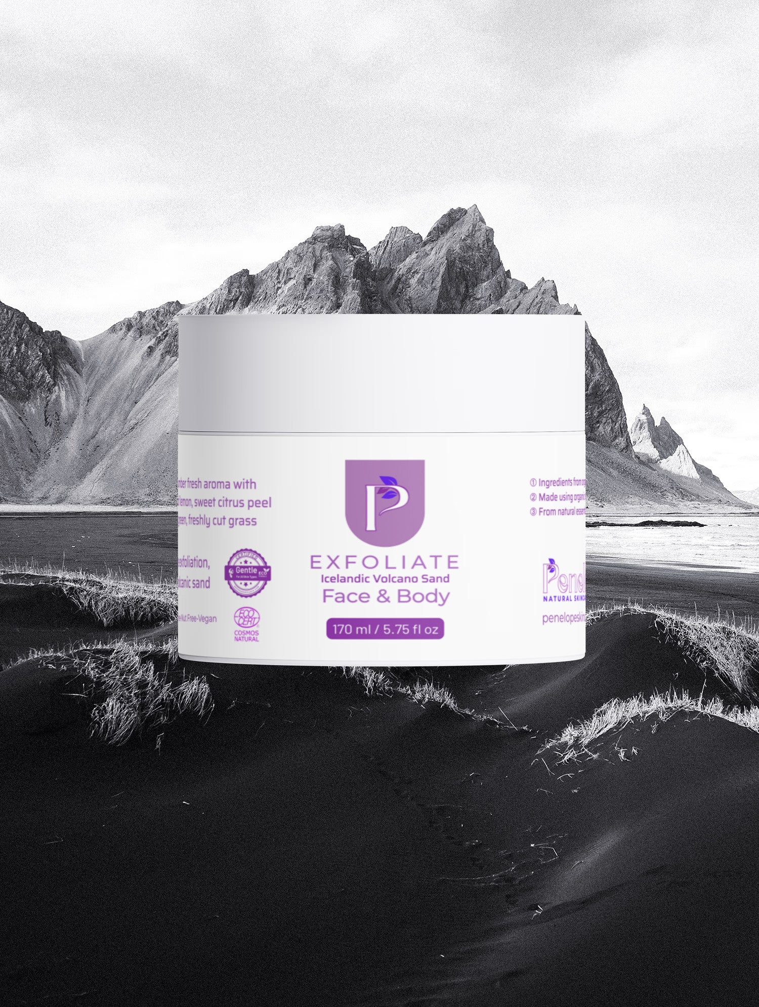 A white jar of Keratin Intensive Recovery Hair Mask with purple branding, centered against a dramatic black-and-white landscape background of mountains and a beach.