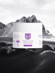 A white jar of Keratin Intensive Recovery Hair Mask with purple branding, centered against a dramatic black-and-white landscape background of mountains and a beach.