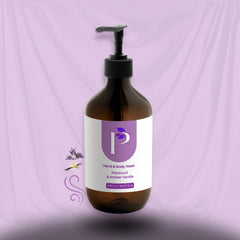 A 300 ml amber glass pump bottle of hand and body wash with a white and purple label, set against a draped lavender fabric background.