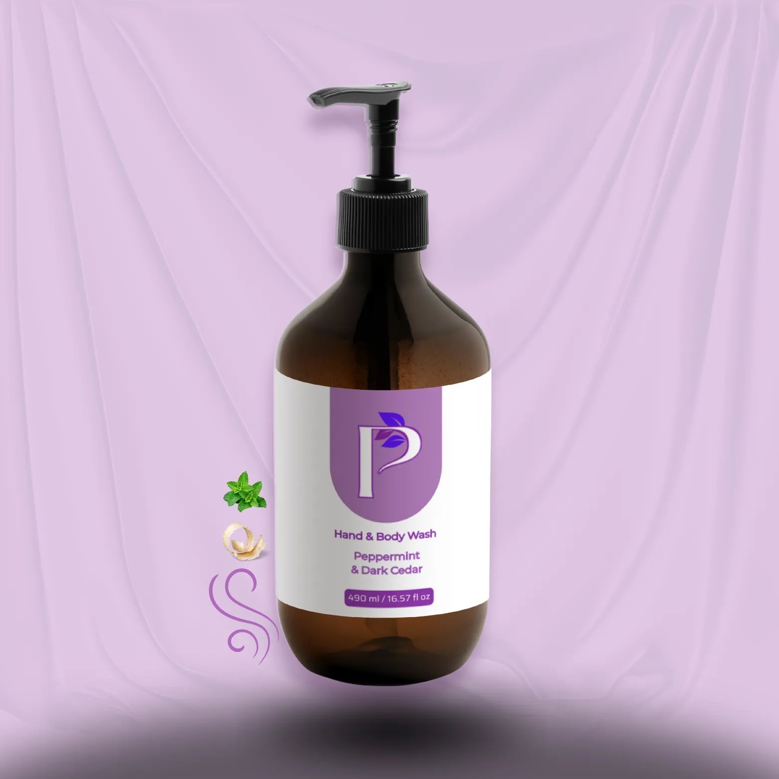 An amber glass pump bottle of hand and body wash with a black dispenser and a white label featuring a purple logo, set against a draped lavender background.