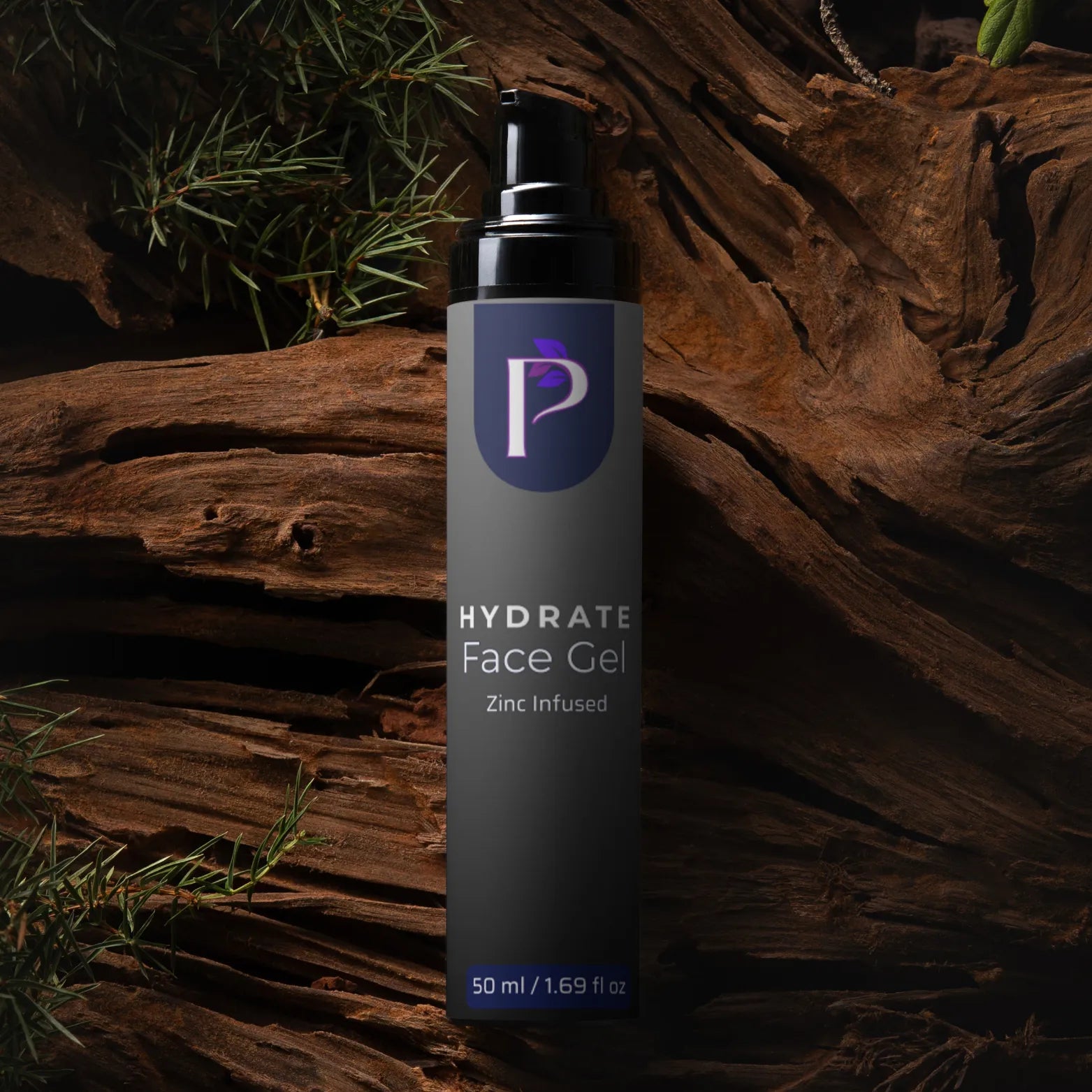 A 50 ml bottle of Hydrate Face Gel with Zinc Infused, featuring a dark gray body and black pump, set against a rustic background of weathered wood and pine needles.
