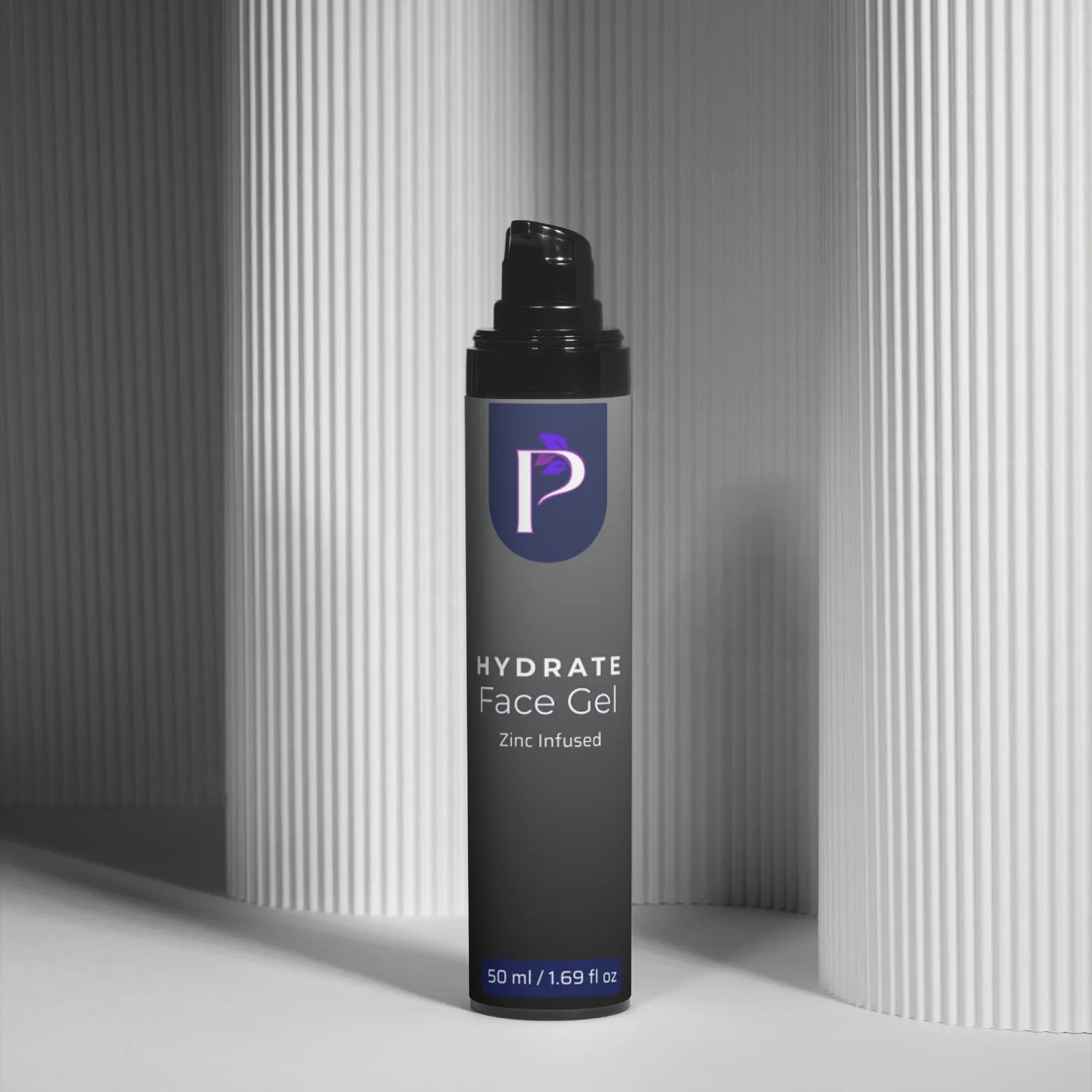 A single bottle of P hydra te Face Gel stands upright on a white surface between two gray ribbed columns. The bottle is dark gray with a black pump cap and a blue-purple logo panel on the front.