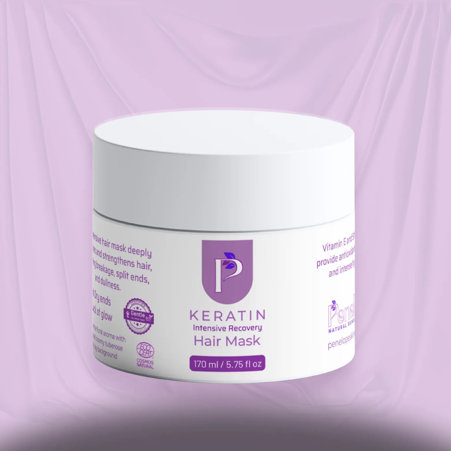 A white jar of Keratin Intensive Recovery Hair Mask with purple text and logo, set against a draped lavender background.