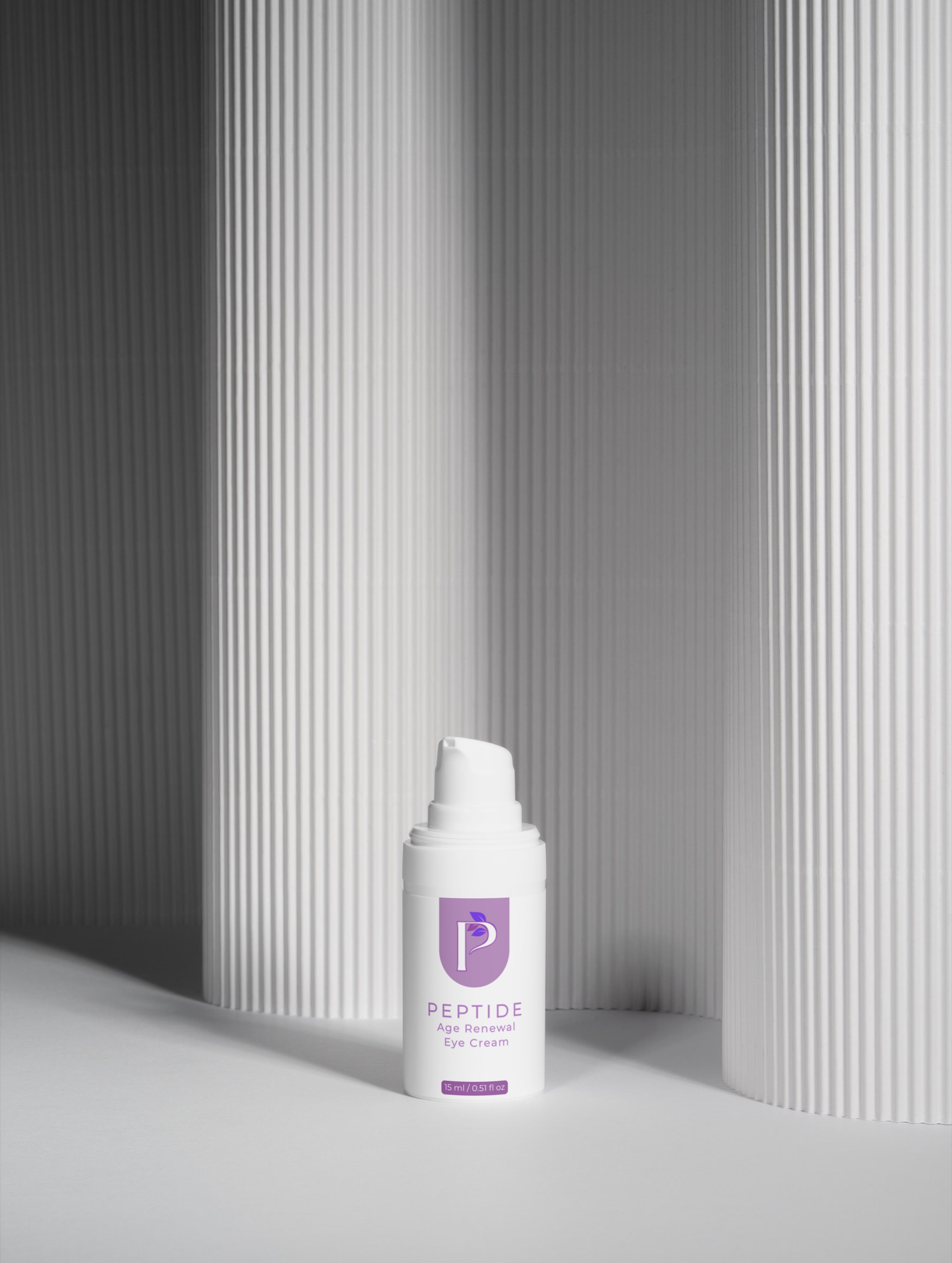 Peptide Eye Cream eye cream bottle on a gray background