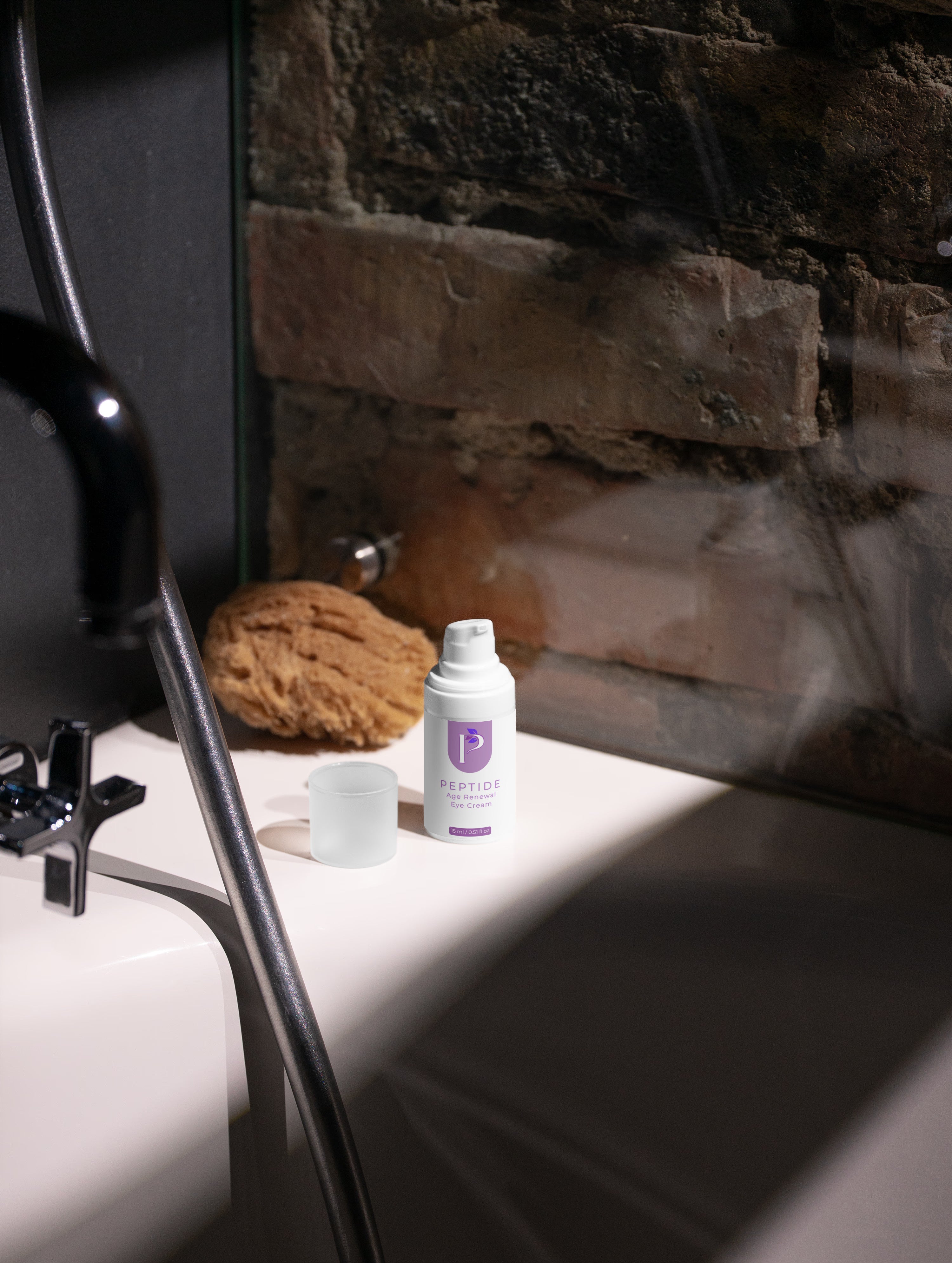 Bottle of lotion on a bathroom counter with a stone wall background